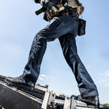 Person wearing Reebok Trailgrip Tactical 8 side zip waterproof boot in black